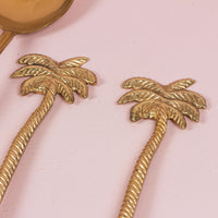 A set of Salad Servers with palm tree motif