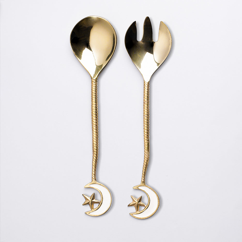 A set of salad servers with crescent motif
