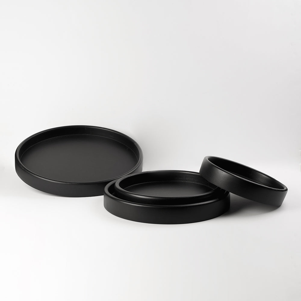 A set of 4 round serving trays