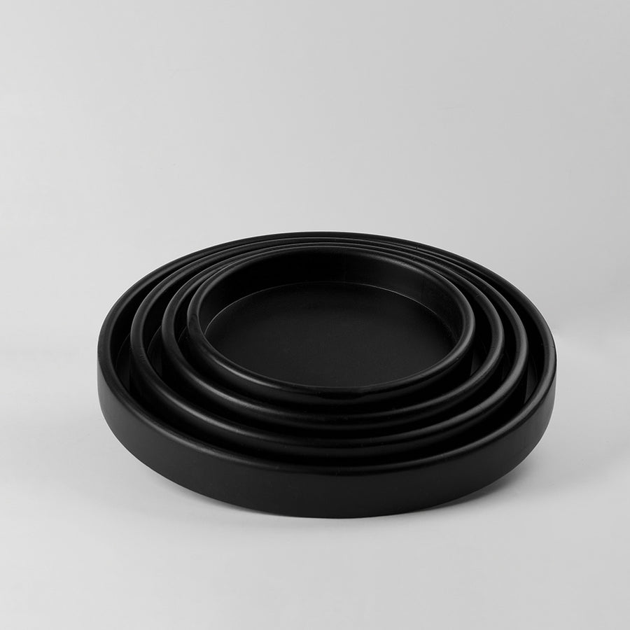 A set of 4 round serving trays